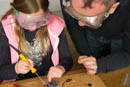 Louise learns to solder at Science Week in Edinburgh. Damian solders vicariously.